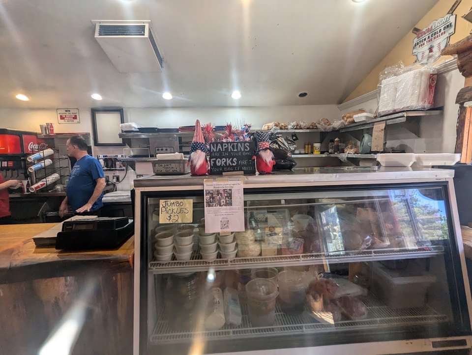 Outdoor tables beside a mountain-view setting.